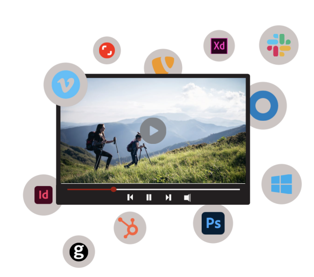 A video player displays two hikers on a mountain, surrounded by various application icons.